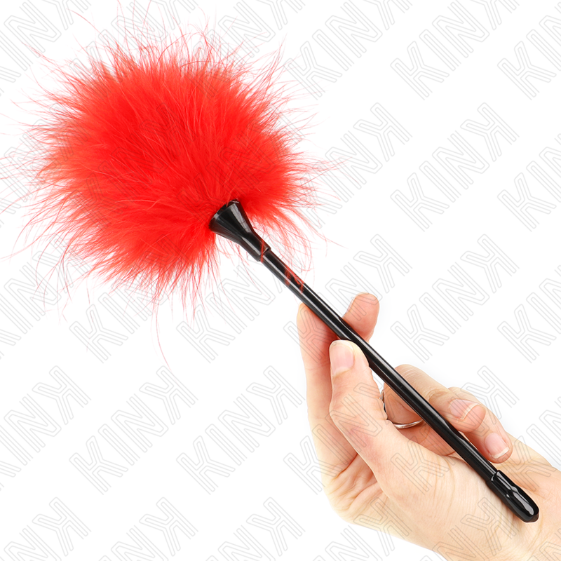 Red feather tickler held in hand, ideal for playful sensory experiences and light teasing.