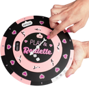 Close-up of hands spinning a 'Play & Roulette' game wheel with hearts and numbers in a playful design.