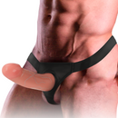 Body wearing a black harness with a realistic penis extender attachment.