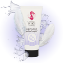 Water-based skincare lotion tube with splashing water and feathers, emphasizing natural comfort for travel.