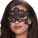 Woman wearing an elegant black lace eye mask with intricate design against a light background.