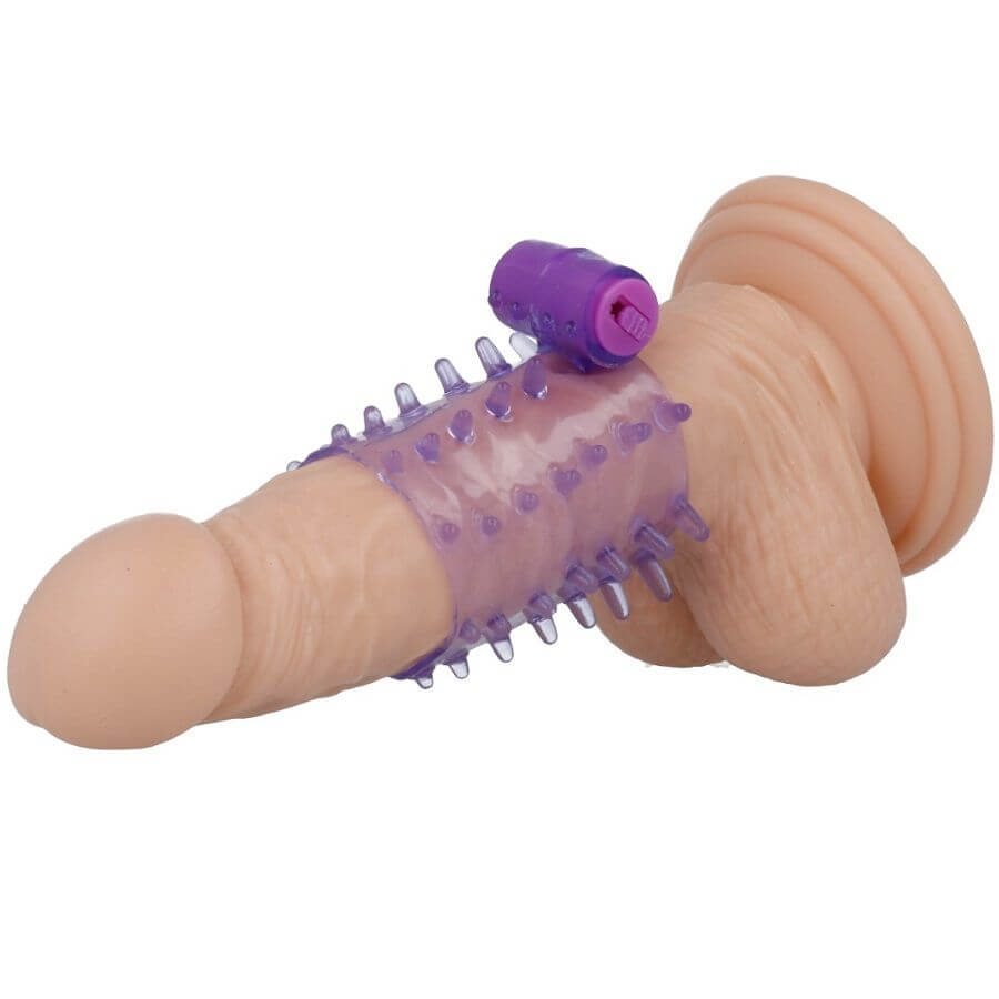 Silicone penis sleeve with purple vibrating bullet for enhanced stimulation and pleasure.
