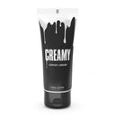 Black tube of creamy lubricant with white drip design and text "CREAMY" on the label.