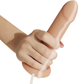 Hand holding Mythology Flipper Original Dildo with ejaculation function, showcasing realistic design for fantasy play.
