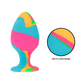 Multicolor silicone plug with tie-dye design and conical shape, featuring a suction cup base for versatile play.