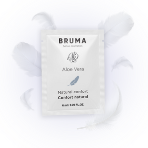 BRUMA Aloe Vera Sliding Gel 6ml sachet surrounded by soft white feathers, emphasizing natural comfort and sensual lubrication.