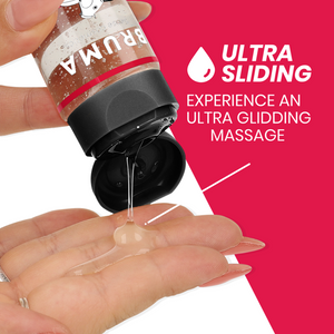 BRUMA Premium Massage Hot Oil Strawberry 3 in 1, bottle dispensing oil onto fingers, ultra sliding massage effect, 100 ml.