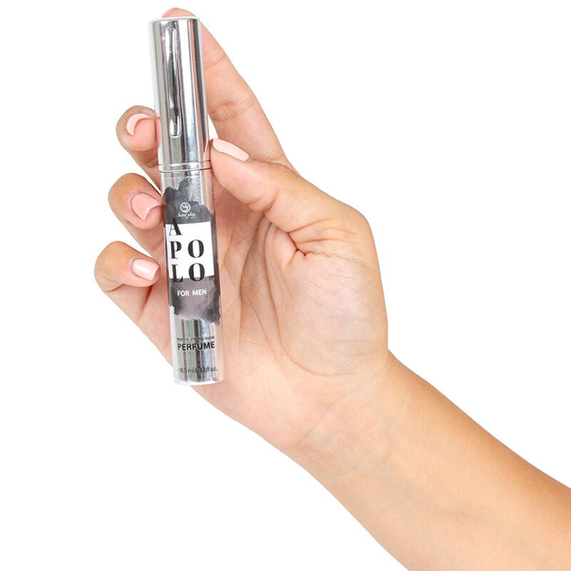 Hand holding Apolo pheromone perfume spray for men, travel size. Enhances attractiveness and confidence with natural scent.