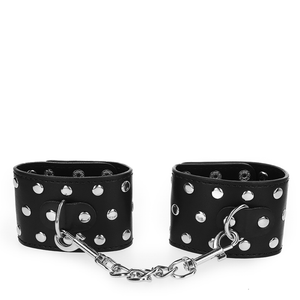 KINK - WRIST RESTRAINTS WITH SNAP FASTEN FULL OF RIVETS BLACK ADJUSTABLE 19-24 CM X 5.5 CM - LoveYou.lv