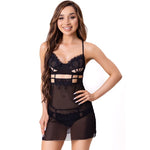 Woman wearing LIVCO Corsetti Maia black babydoll camisole and thong set with cutouts, showcasing elegant lace design in S/M size.