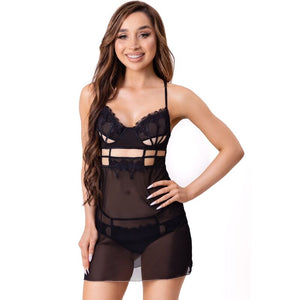 Woman wearing LIVCO Corsetti Maia black babydoll camisole and thong set with cutouts, showcasing elegant lace design in S/M size.