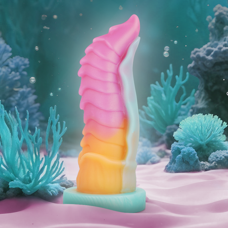 Colorful Kelpie dildo by EPIC, inspired by mythological water spirit horse, posed in an underwater setting with vibrant coral.
